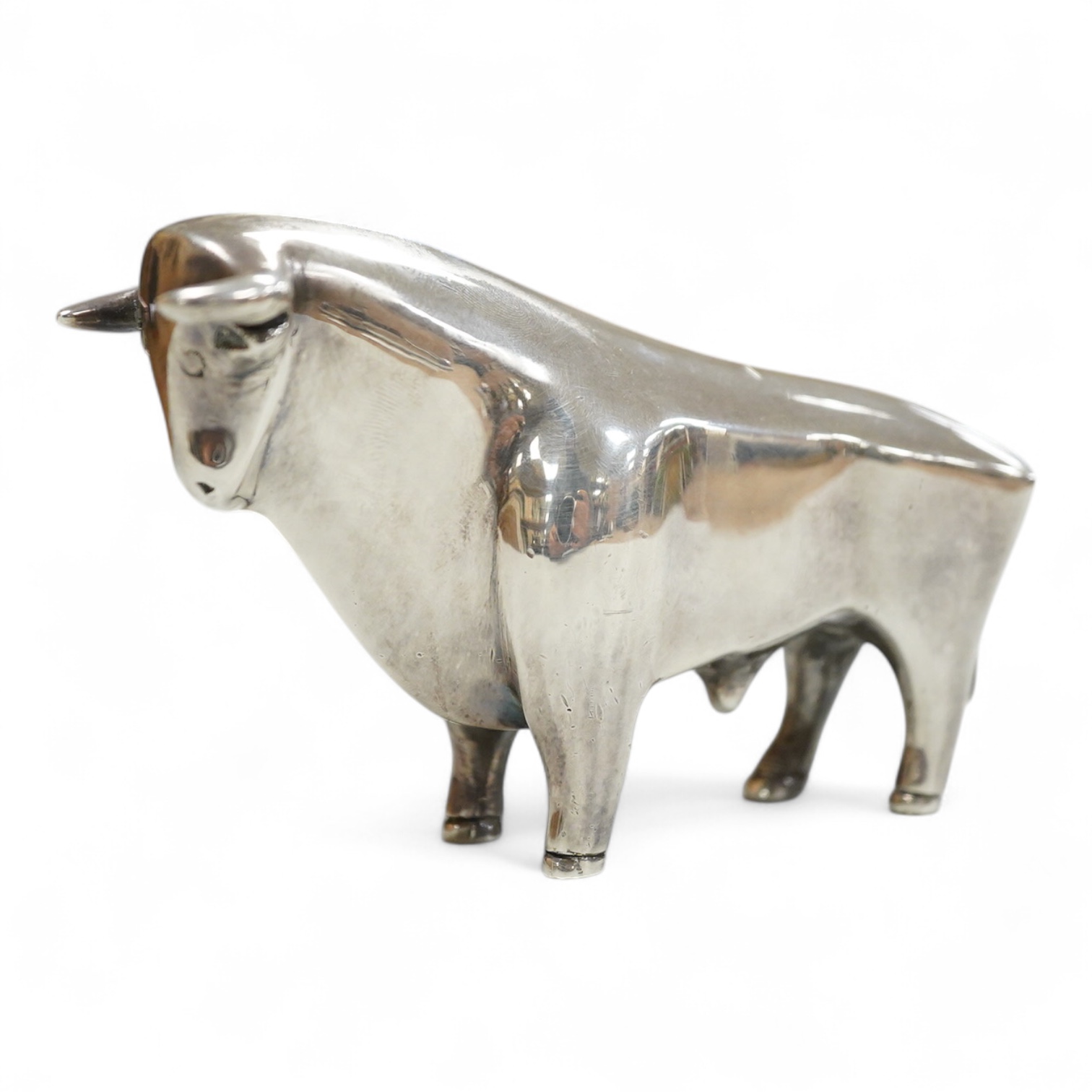 A stylised white metal (stamped 925) miniature model of a bull, length 11.5cm, height 7cm, 30oz.